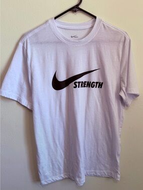 Nike White Tee with Black Swoosh and 'Strength' Text